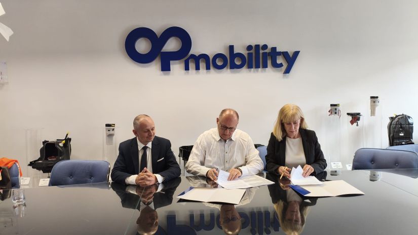podpisanie porozumienia między ZSTK a OPmobility.